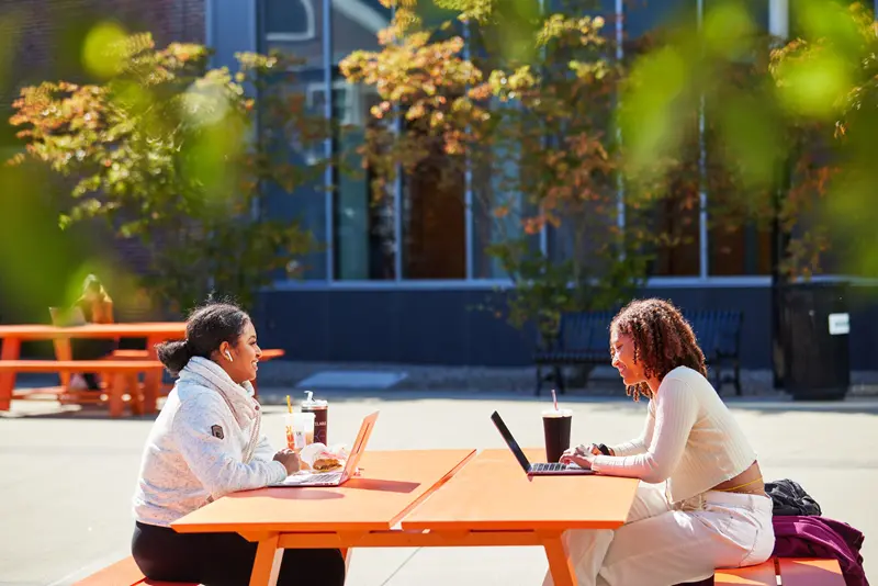 students on picnic bench